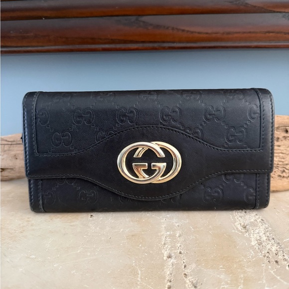 Gucci Handbags - Gucci Black Embossed Leather Wallet with Gold GG Logo